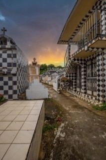 Famous cemetery, many mausoleums or large tombs decorated with tiles, often in black and white.