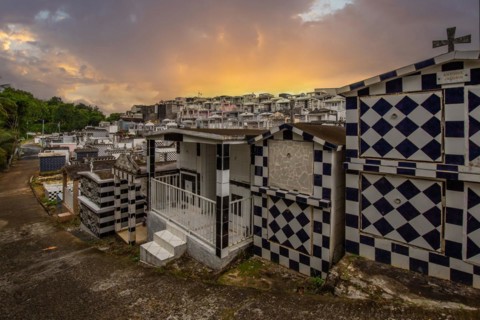 Famous cemetery, many mausoleums or large tombs decorated with tiles, often in black and white.
