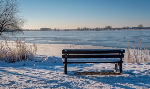 A snow-covered bench overlooking the frozen expanse of a lake AI generated