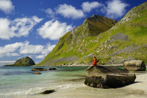 Landscape with sea at the sandy beach of Haukland (Hauklandstranda) with the mountain Veggen. A