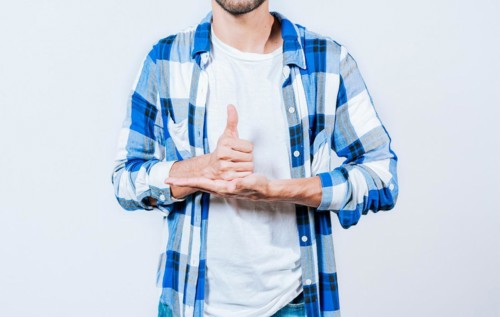 Person gesturing HELP with hands in sign language. Gesture HELP with hands in sign language