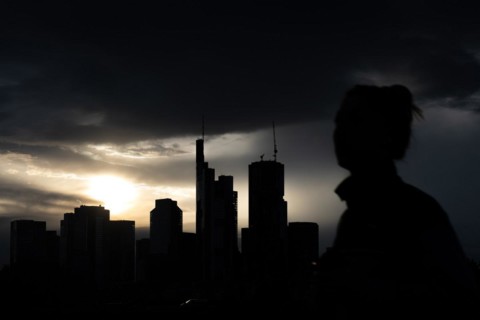 Dense clouds pass over the Frankfurt banking skyline in the evening, Floesserbruecke, Frankfurt am