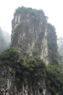 Cruise ship on the Yangtze River, Hubei Province, China, Asia, Lonely rock rises out of the mist,