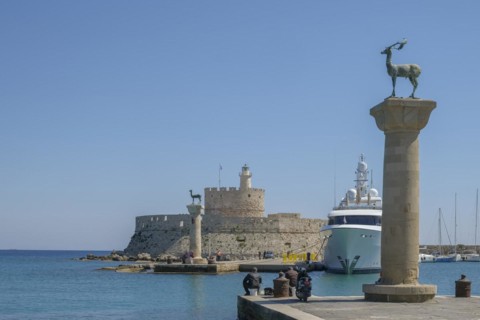 Elafos and Elafina, stag and hind, sculptures on columns, harbour entrance Mandraki harbour,