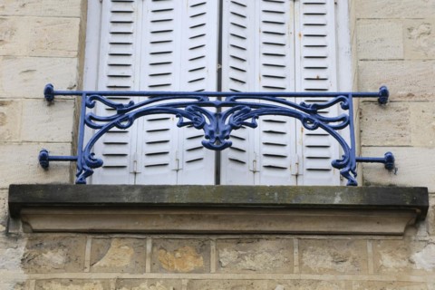 Window railings and balconies on residential buildings designed by Hector Guimard in the Art