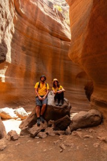 A tourist couple enjoying in the limestone canyon Barranco de las Vacas in Gran Canaria, Canary
