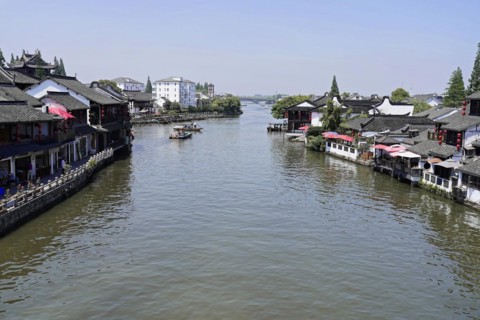 Excursion to Zhujiajiao water village, Shanghai, China, Asia, wooden boat on canal with view of