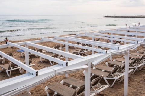 Empty sunbeds on the beach in Sitges, Spain, Europe