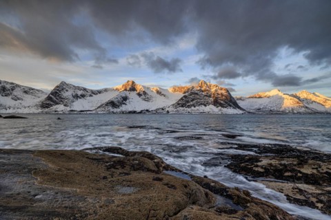 Rocky coast off Bergen, sea, waves, spray, morning mood with clouds, winter, Tungeneset, Senja,