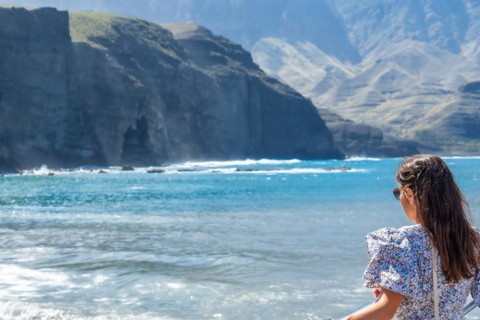 A woman on the beach of Puerto de Las Nieves in Agaete on Gran Canaria, Spain, Europe