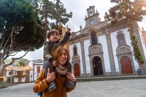 Family tourism visiting the Basilica of Nuestra Senora del Pino in the municipality of Teror. Gran