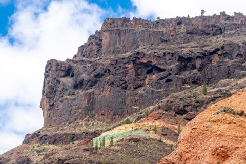 Detail of the colors in the Natural Monument Azulejos de Veneguera or Rainbow Rocks in Mogan, Gran