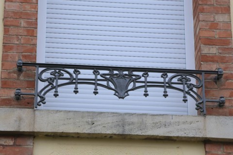 Window railings and balconies on residential buildings designed by Hector Guimard in the Art