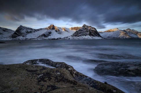 Rocky coast off Bergen, sea, waves, spray, morning mood with clouds, long exposure, winter,
