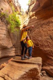 Family on vacation enjoying in the limestone canyon Barranco de las Vacas in Gran Canaria, Canary
