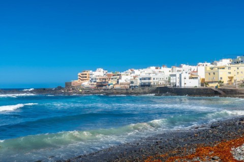 Beautiful beach in summer of Playa el Puertillo and its beautiful town in Gran Canaria. Spain