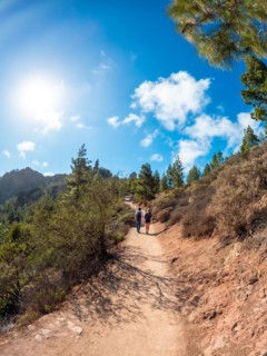 A couple of hikers on the trail up to Roque Nublo in Gran Canaria, Canary Islands