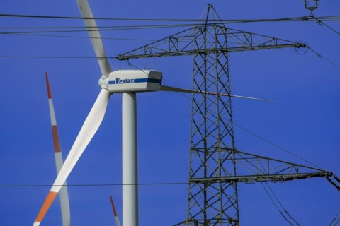 Power pylon with high-voltage lines and Vestas wind turbines at the Avacon substation in Helmstedt,