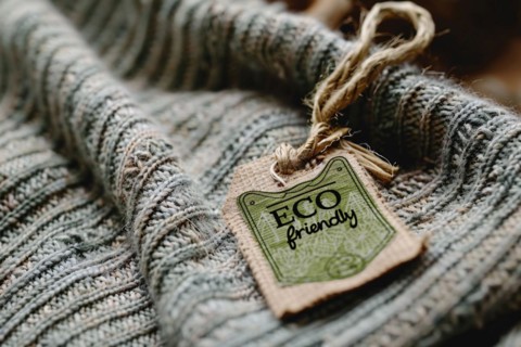 Cotton pullover fabric with green label saying 'ECO friendly'. KI generiert, generiert, AI