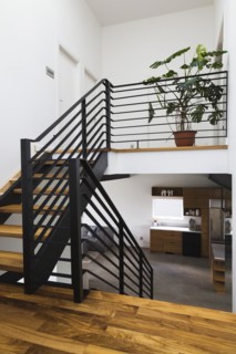 American walnut wood and black powder coated cold rolled steel stairs inside modern cube style