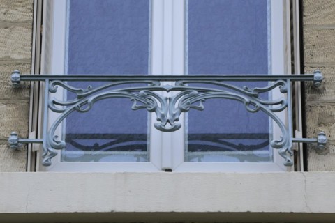 Window railings and balconies on residential buildings designed by Hector Guimard in the Art