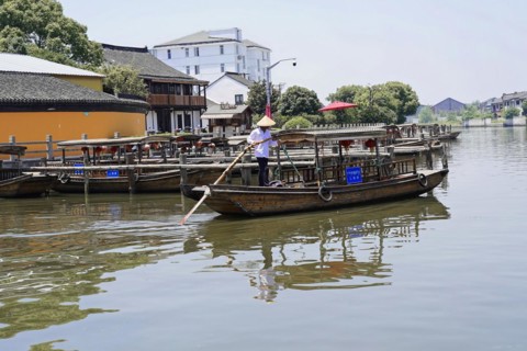 Excursion to Zhujiajiao water village, Shanghai, China, Asia, Wooden boat on canal with view of