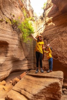 Family on vacation enjoying in the limestone canyon Barranco de las Vacas in Gran Canaria, Canary
