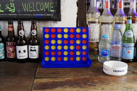 Strolling through the restored Tianzifang neighbourhood, A Connect Four game on a counter in a cafe