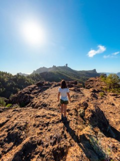 A woman hiker at a viewpoint of Roque Nublo in Gran Canaria, Canary Islands