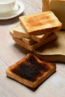 Burnt slice of toast with toast, toast