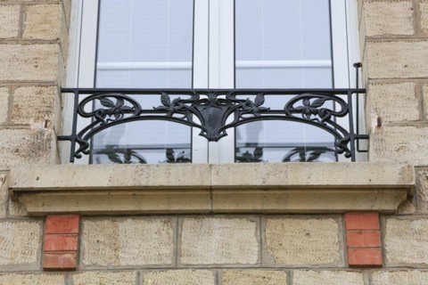 Window railings and balconies on residential buildings designed by Hector Guimard in the Art