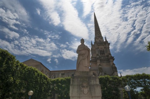 Cathedral Notre Dame de l'Assomption, the tower dates from the 19th century, in front a monument to