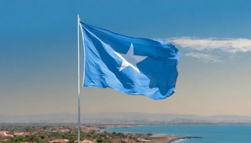 The flag of Somalia, fluttering in the wind, isolated, against the blue sky