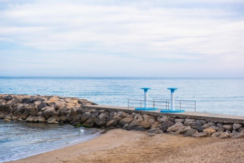 Showers on the beach in Sitges, Spain, Europe
