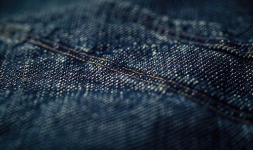 Closeup view of dark indigo denim material AI generated