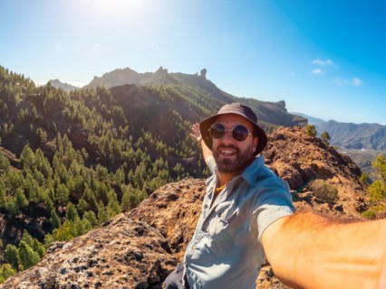 Selfie of a hiker at a Roque Nublo viewpoint in Gran Canaria, Canary Islands