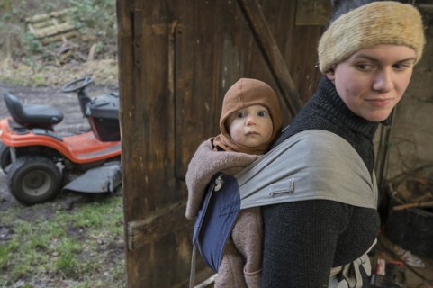 Young mother with her son, 8 months, in a sling on her back, Mecklenburg-Vorpommern, Germany,