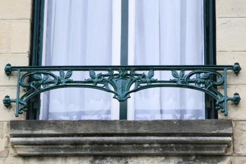 Window railings and balconies on residential buildings designed by Hector Guimard in the Art