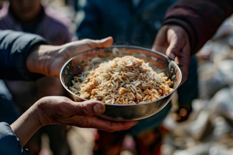 Close up of person's hand holding plate with food at charity food distribution. KI generiert,