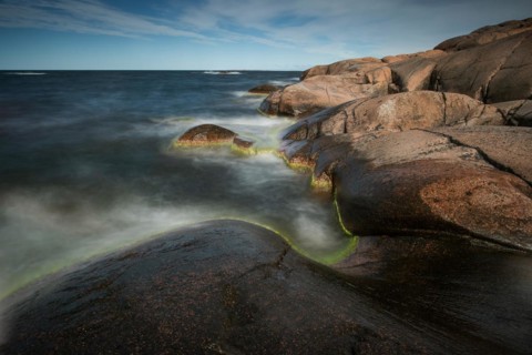 Red granite, rocky coast, surf, long exposure, Havsvidden, Geta, Aland, Aland Islands, Finland,