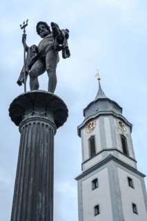Neptune standing on a column, Neptune Fountain in front of the Minster of Our Lady, market square