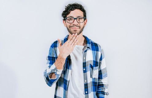 Person making THANK YOU gesture in sign language isolated. Man showing THANK YOU gesture in sign