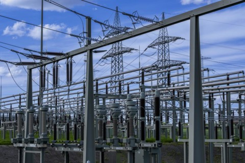 Power pylons with high-voltage lines and insulators at the Avacon substation in Helmstedt,