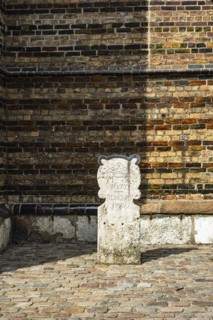 Boundary stone with the coat of arms and initials of St Mary's Church and the date 1672 renovat