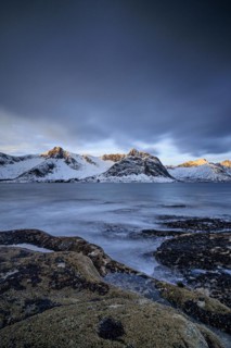 Rocky coast off Bergen, sea, waves, spray, morning mood with clouds, long exposure, winter,