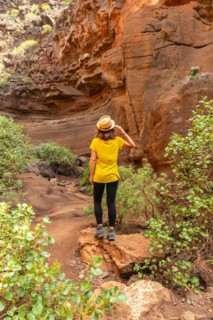 A woman tourist in the limestone canyon Barranco de las Vacas in Gran Canaria, Canary Islands