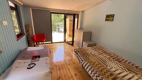 Interior of a hotel room with a double bed. Nobody inside