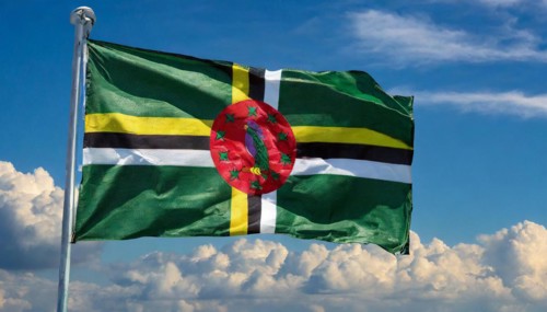 The flag of Dominica, Lesser Antilles, Caribbean, fluttering in the wind, isolated, against the