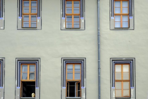 The bust of Johann Wolfgang von Goethe in the lower left window in rows of windows of the Red