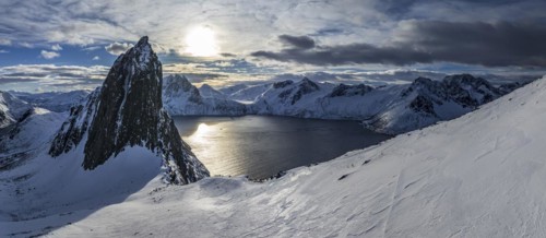 Aerial view of Bergen by the sea, fjord, sunbeams, winter, snow, panorama, Mount Segla, Senja,